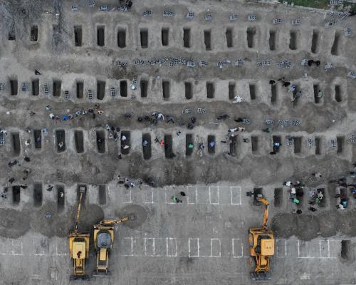 A photo of Iran’s bombed schoolgirl graveyard went around the world. Was it real, or AI?