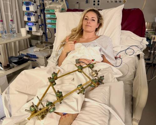 Lindsey Vonn back in US for treatment but ‘not yet able to stand’ after Olympic crash